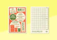 Laden Sie das Bild in den Galerie-Viewer, TRAVELER'S COMPANY - Traveler's Notebook Passport - 2027 Plastik Schreibunterlage